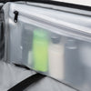 Clear pouch with toiletries inside, showing a close-up of the product arrangement.