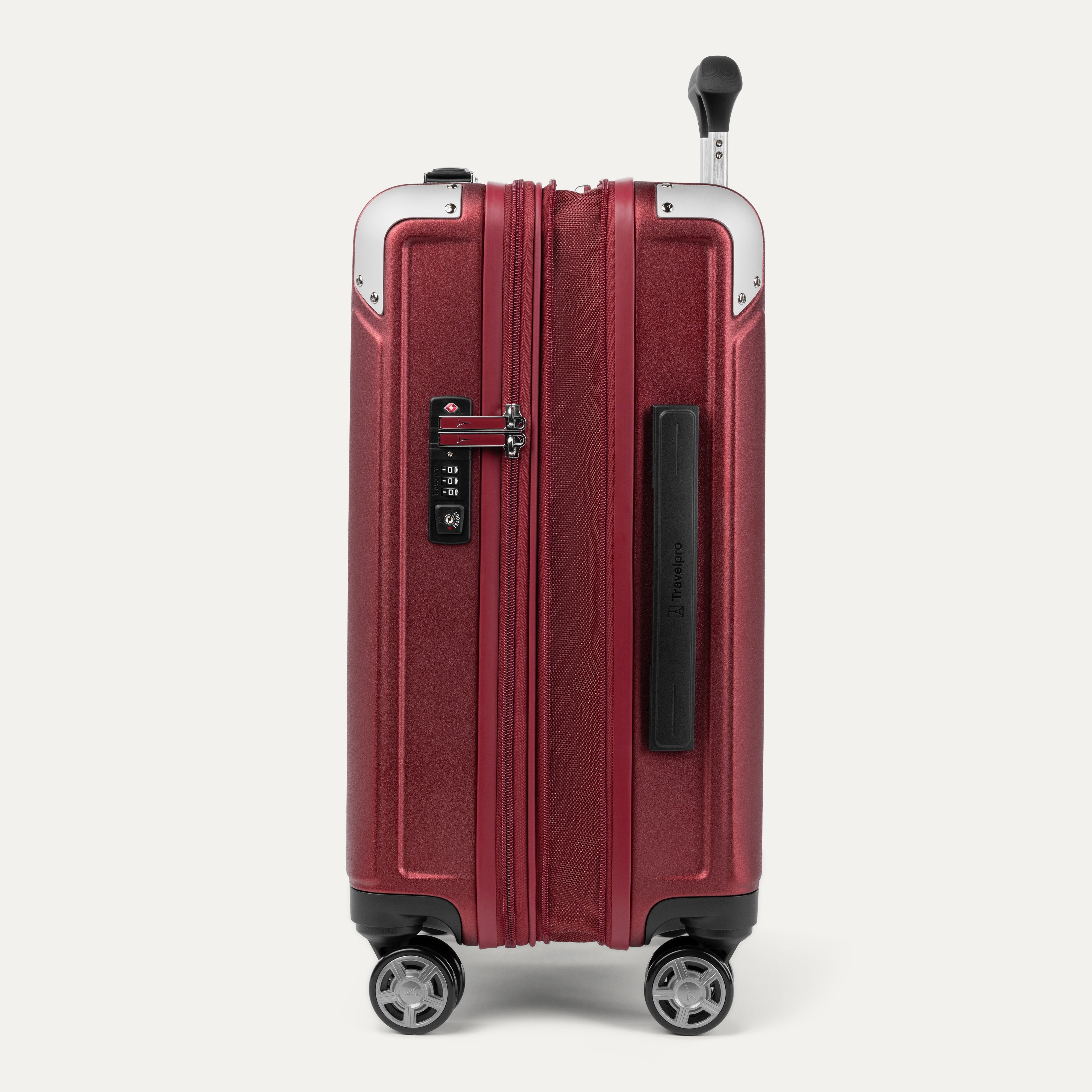 Side view of red suitcase with combination lock on a white background