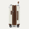 Side view of expanded cream white suitcase with combination lock on a white background