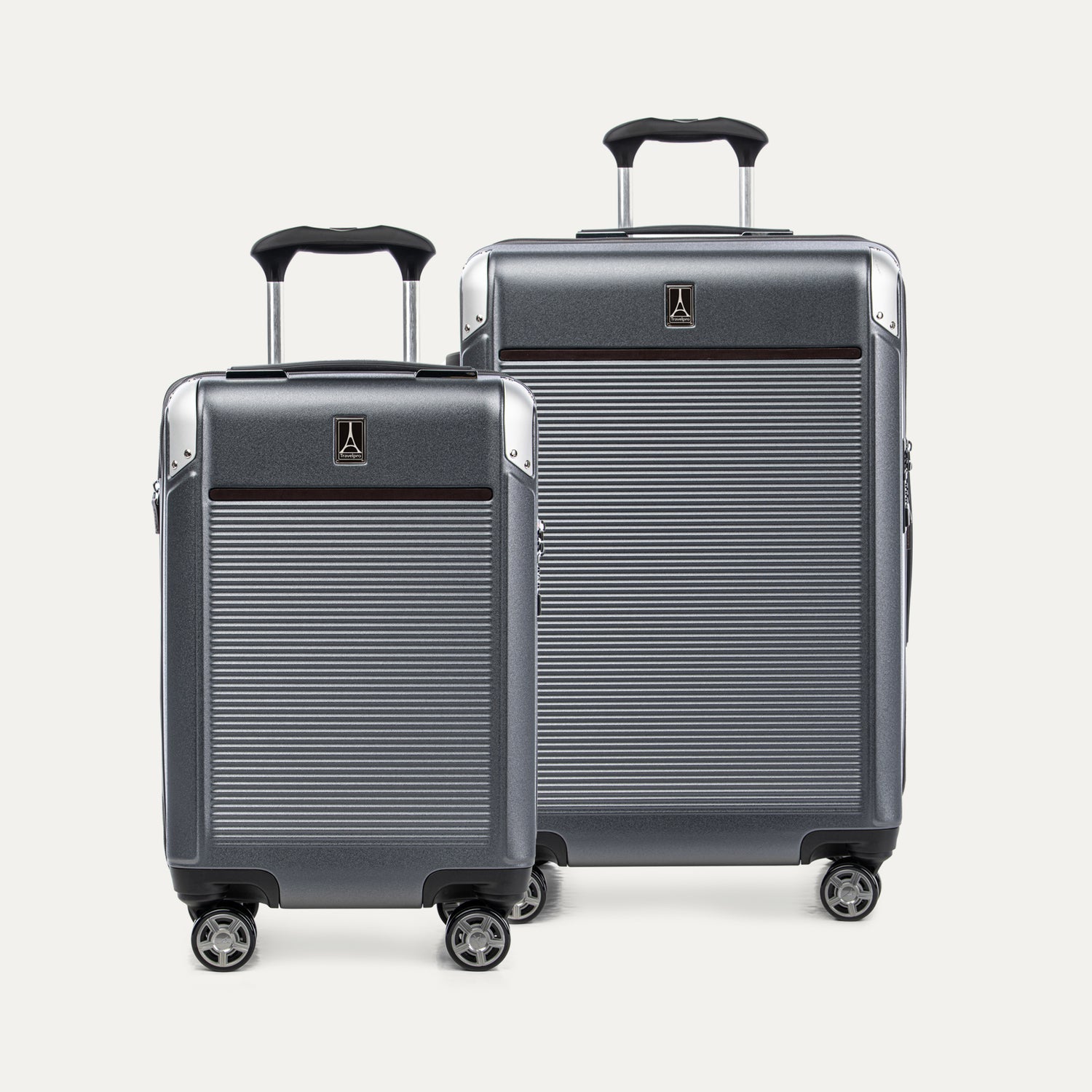 Two gray suitcases with visible Travelpross logo on a white background