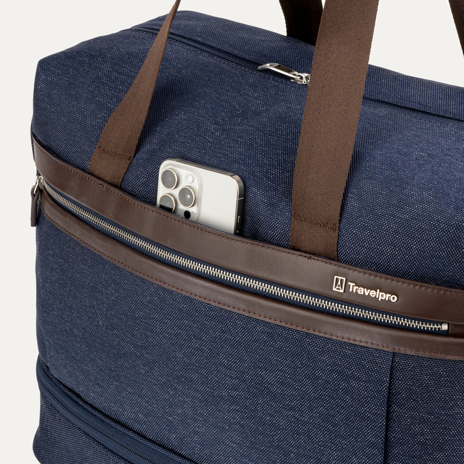 Blue weekender with brown straps and a phone in a pocket, featuring the Travelpross logo.