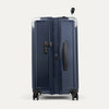 Side view of true navy suitcase expanded and with a tsa lock on a white background