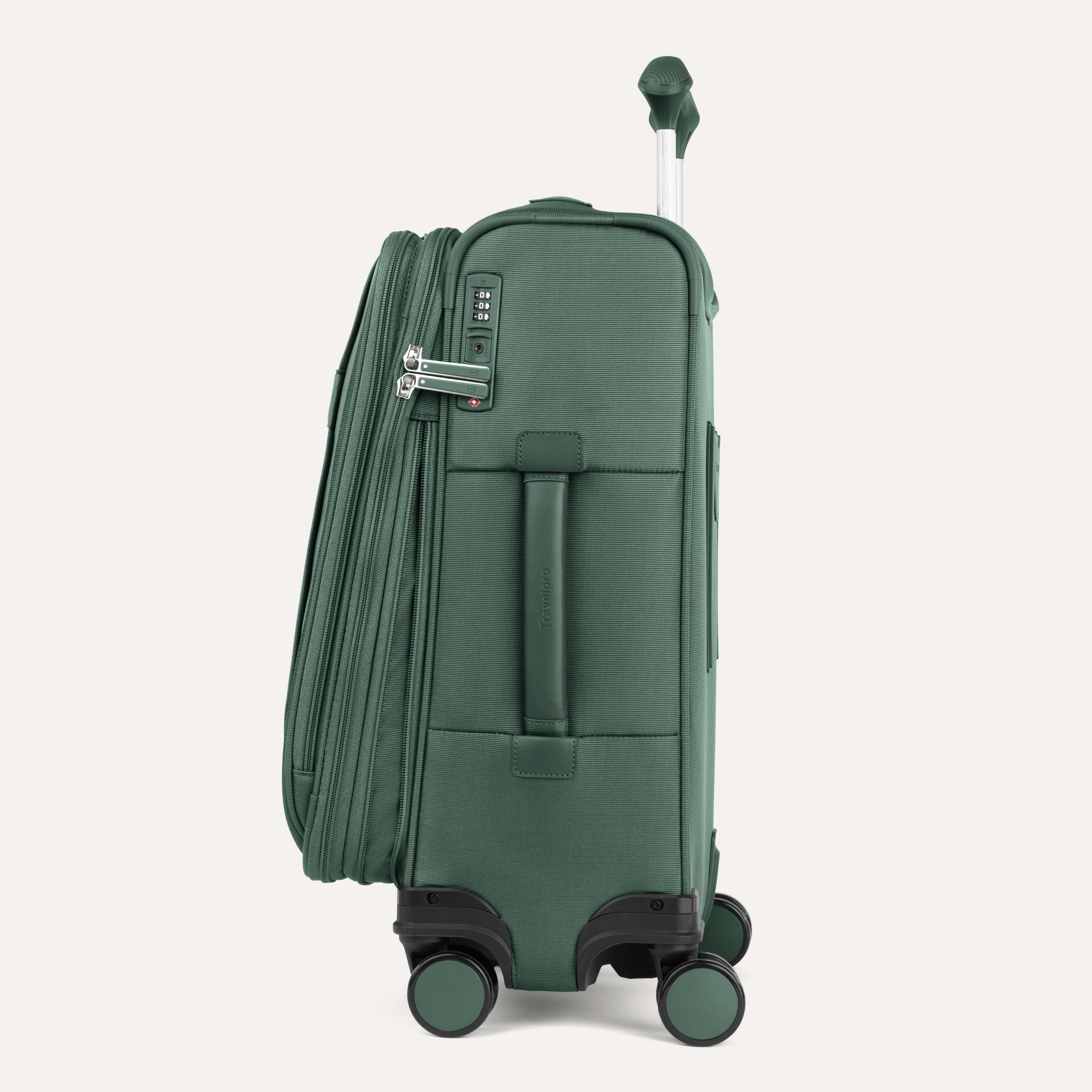 Green suitcase with black wheels on a white background