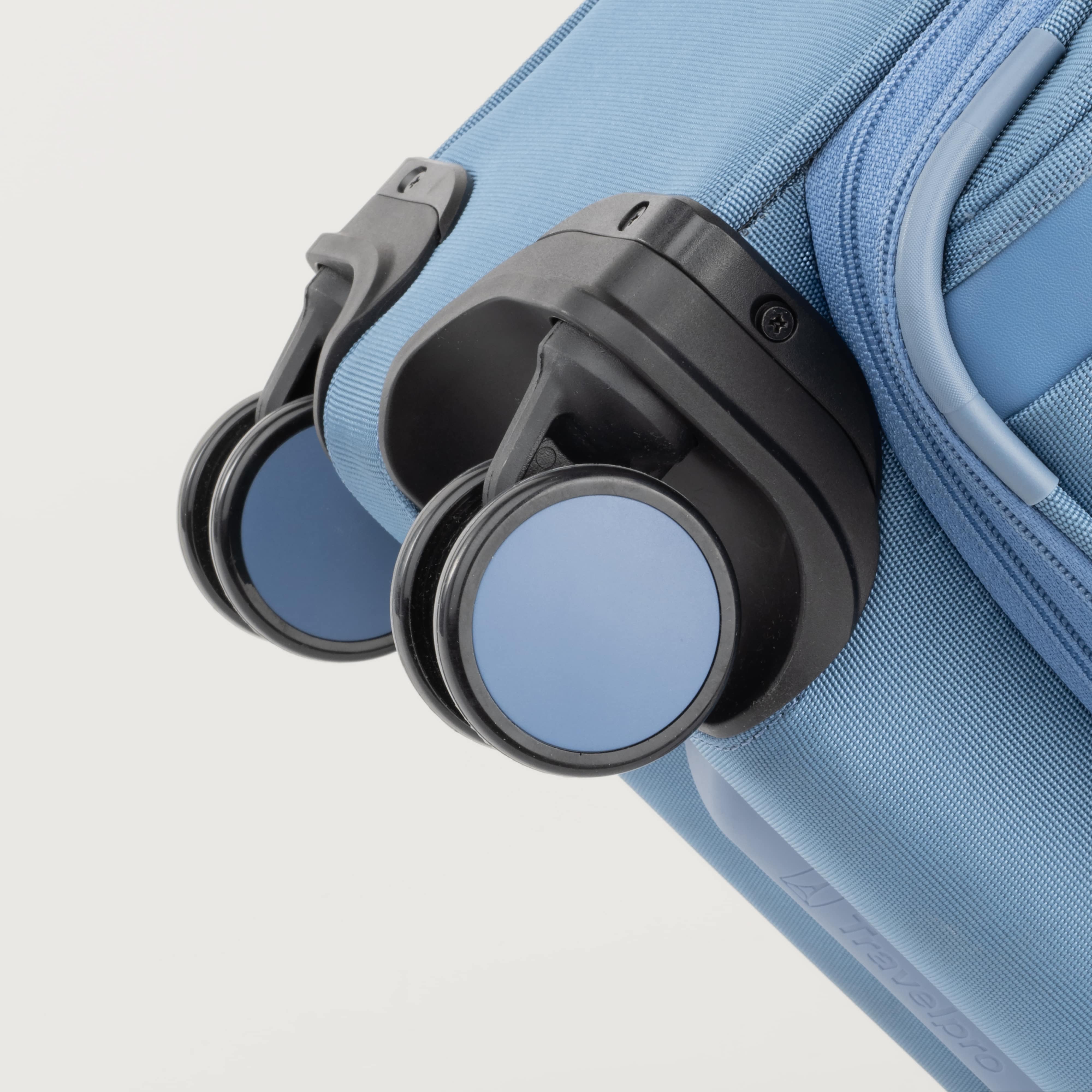 Blue suitcase with black wheels on a white background