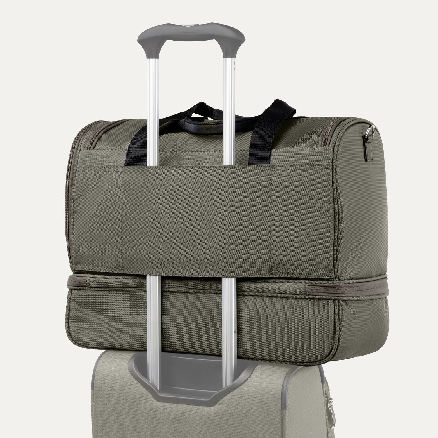 Green weekender bag with rear strap on a white background