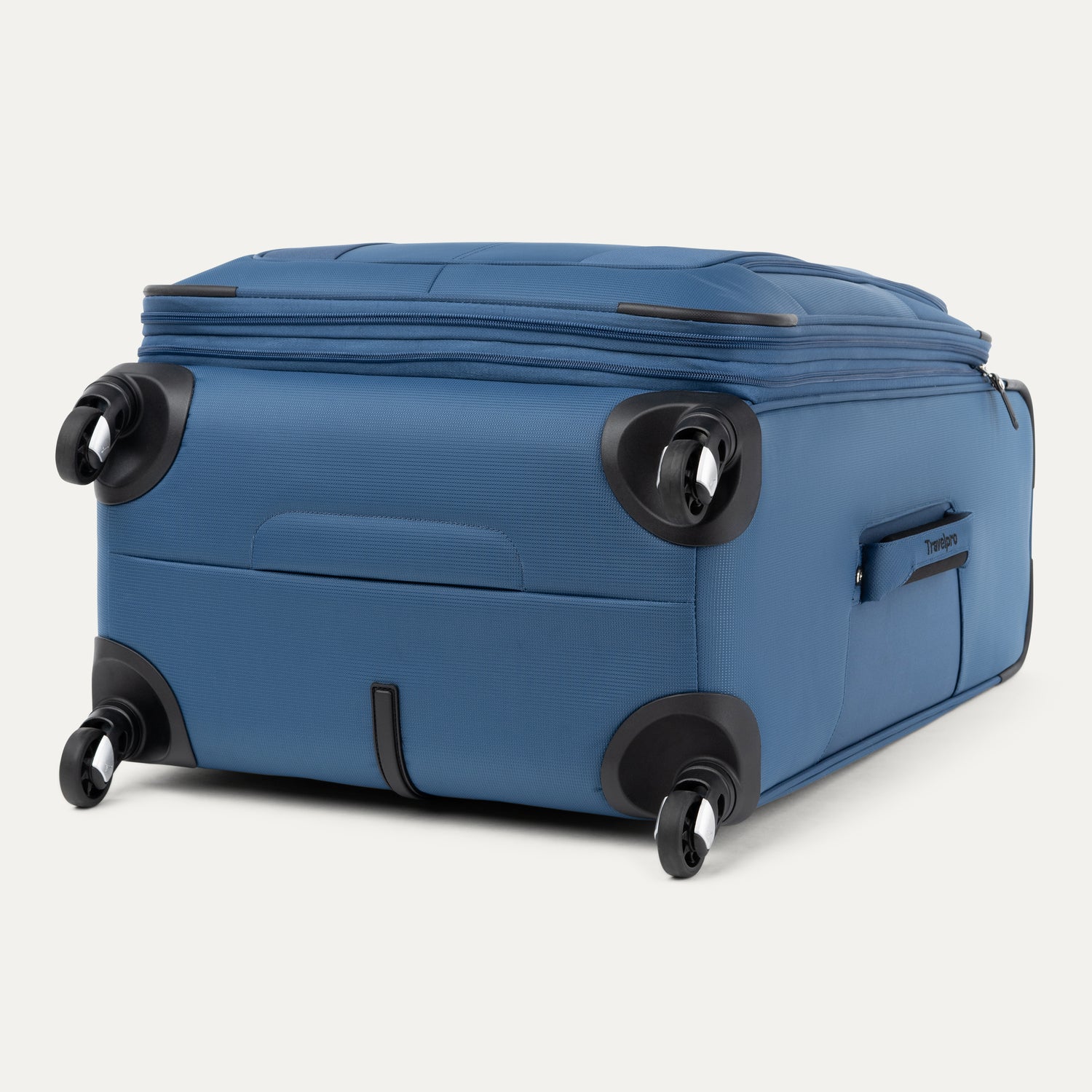 Blue suitcase with black wheels on a white background