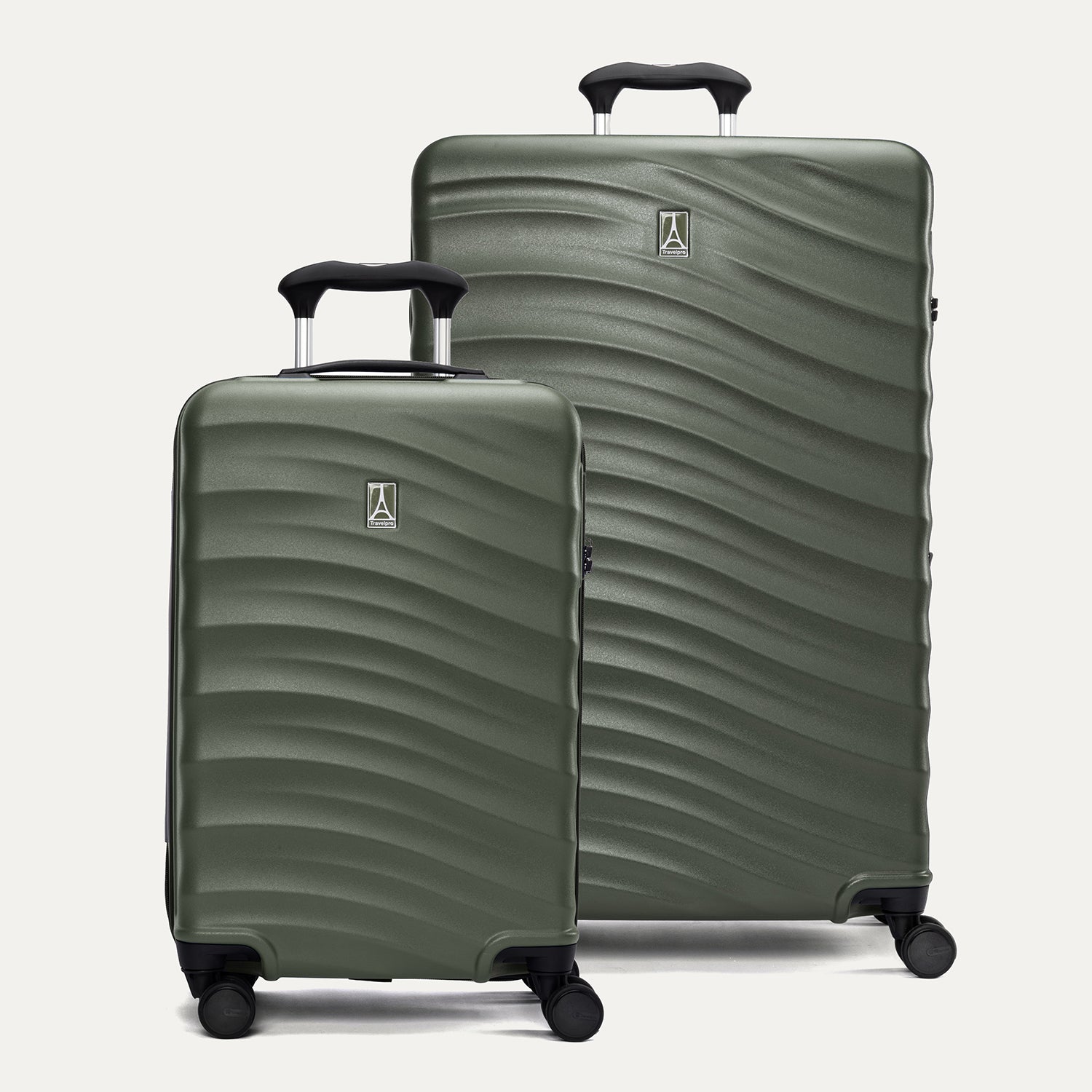 A set of two green Maxlite Air V2 hardside spinner suitcases, one carry-on size and one large check-in size, with a textured surface, integrated handles, and wheels.