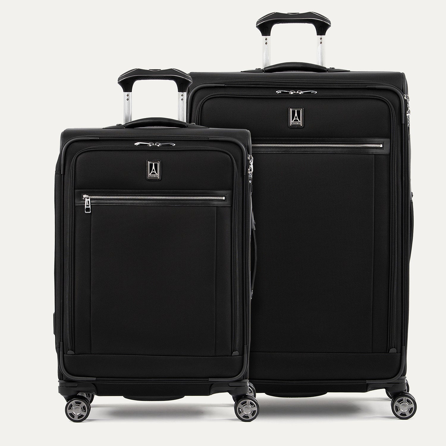 A set of two black suitcases with spinner wheels, both with the Travelpross logo on the front on a white background
