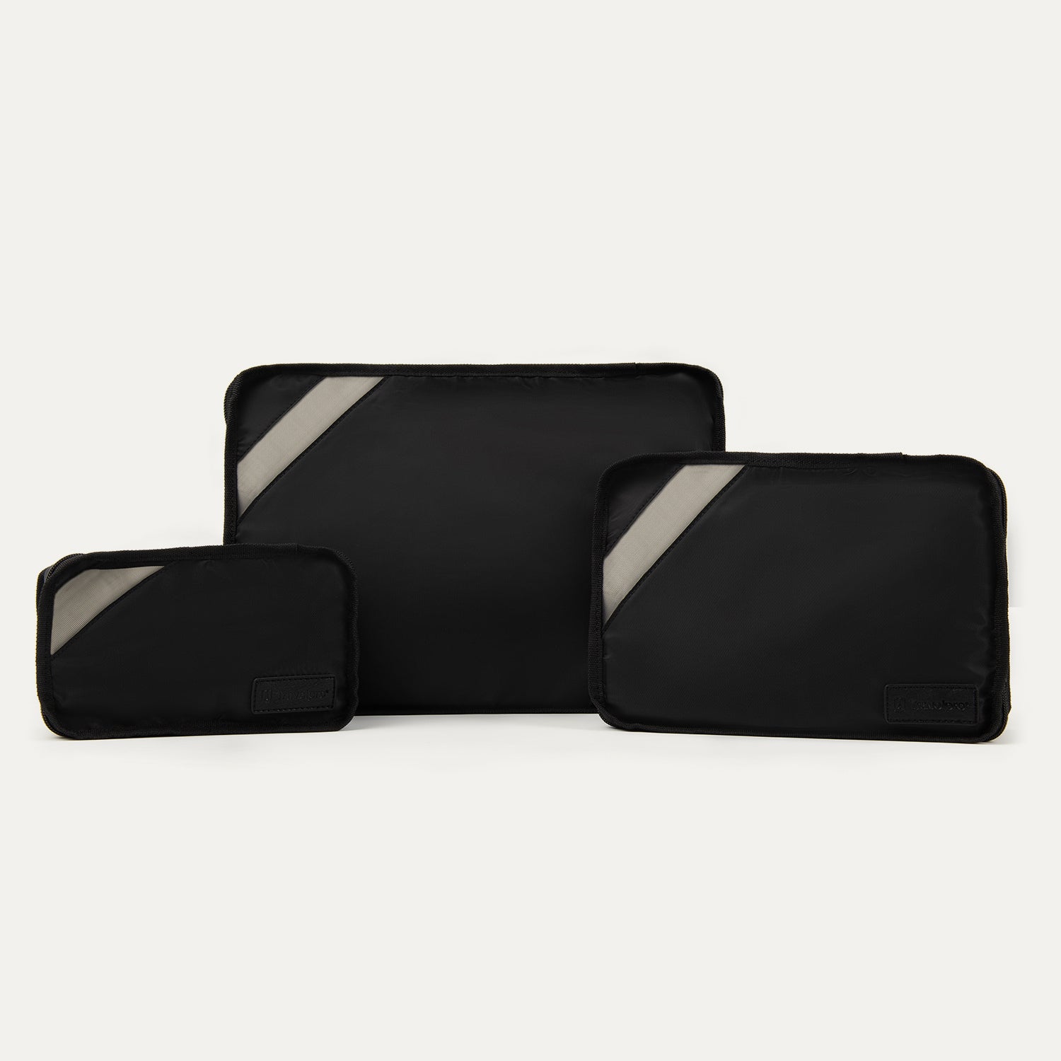 Front view of Travelpross Essentials 3 Pack Packing Cube Set (S/M/L) in BLACK, with diagonal accent panels