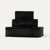 Rear view of Travelpross Essentials 3 Pack Packing Cube Set (S/M/L) in BLACK, stacked to show integrated grab handles.
