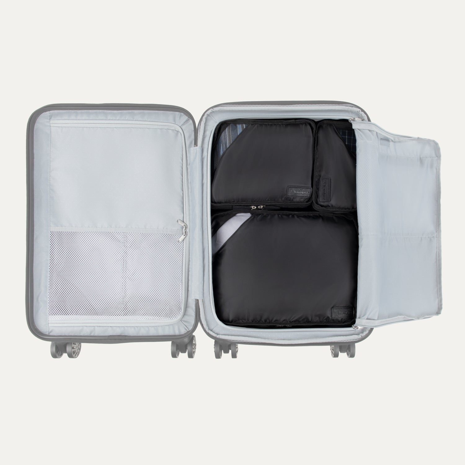 Top view of Travelpross Essentials 3 Pack Packing Cube Set in BLACK, efficiently arranged inside an open hardside carry-on.