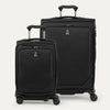 A set of two black spinner suitcases, one carry-on size and one check-in size on a white background 