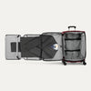 Open suitcase with fold out suiter and clothes on a white background