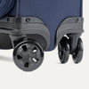 Close-up of suitcase wheels on a white background