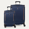 A set of two blue spinner suitcases, one carry-on size and one check-in size, with brown accents on a white background 
