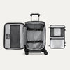 Open black suitcase featuring deluxe tie-down system on a white background