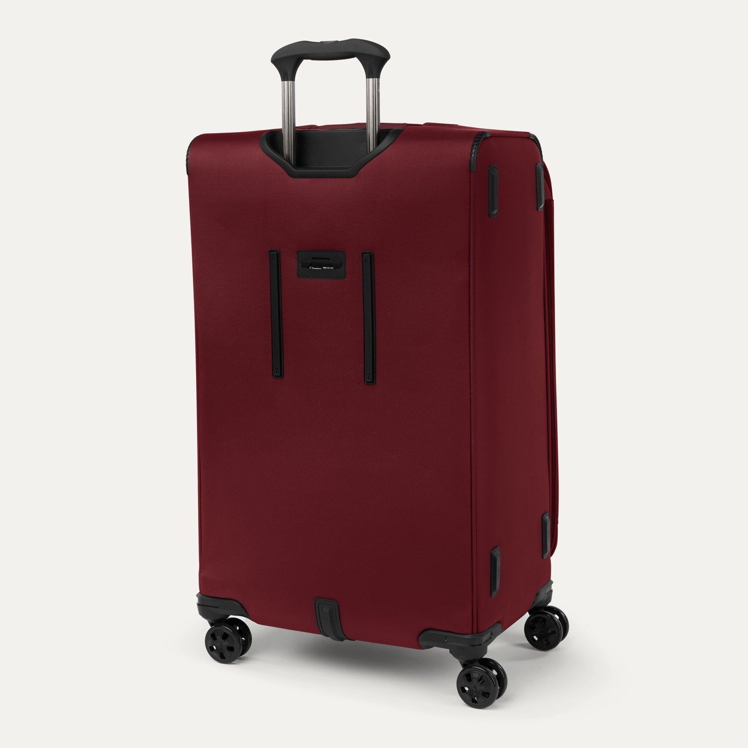 Rear view of the Crew™ Classic Large Check-In Spinner in Rosewood Red, featuring the extension handle and spinner wheels.
