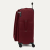 **Side view of the Crew™ Classic Large Check-In Spinner in Rosewood Red, featuring the TSA-approved lock, extension handle, and spinner wheels.**
