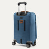 Blue suitcase with wheels and handle on a white background