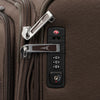 Close-up of a suitcase lock on a brown suitcase.