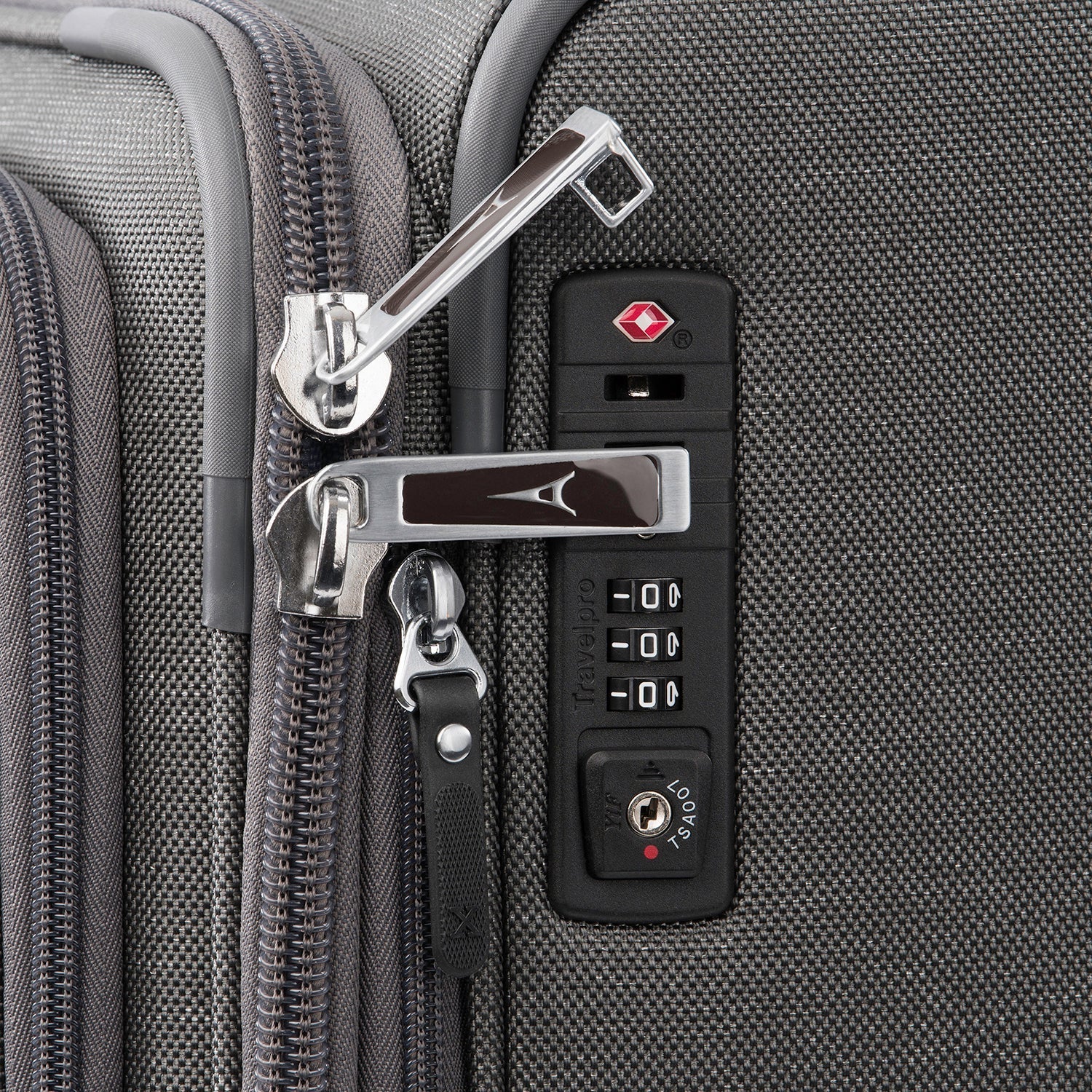 Close-up of a suitcase zipper and lock mechanism.