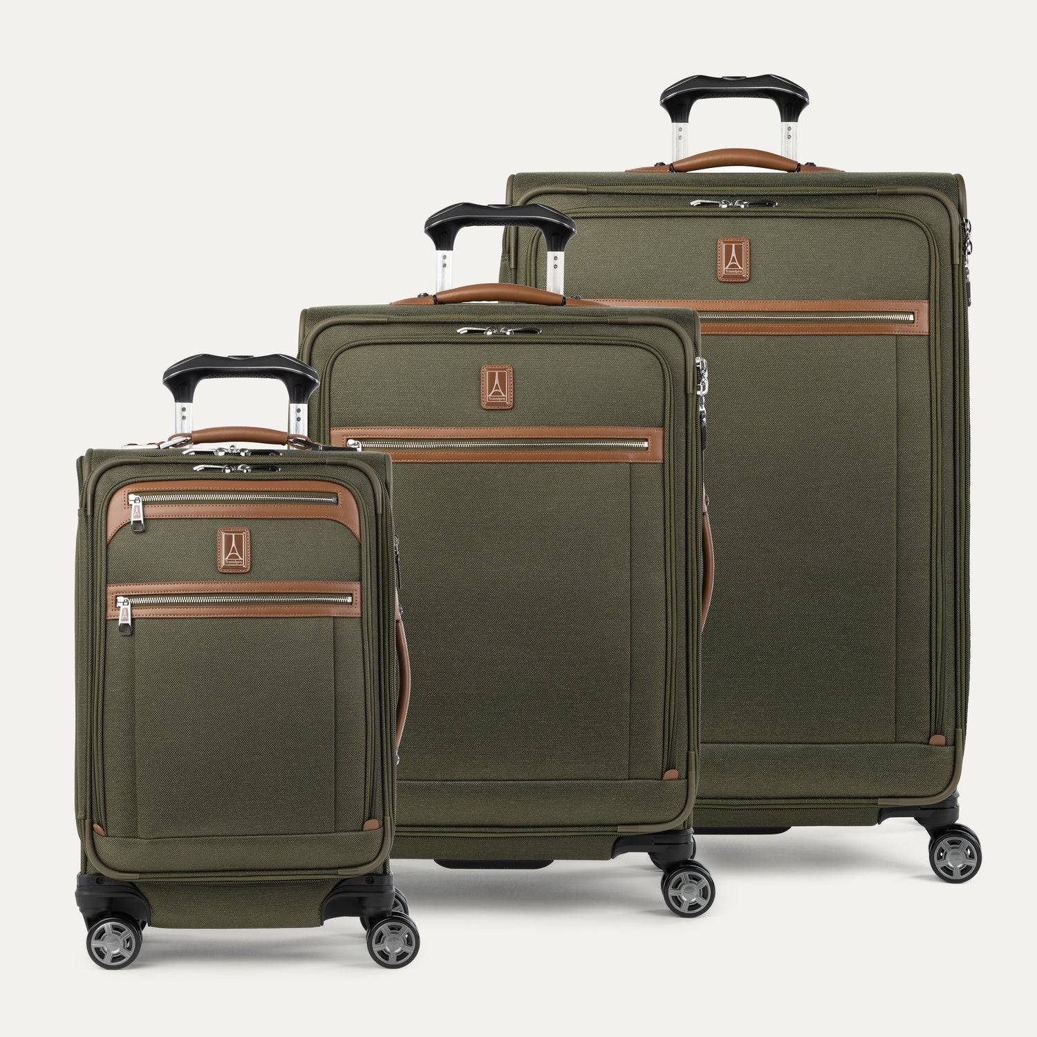 Set of three green suitcases with brown accents on a plain background