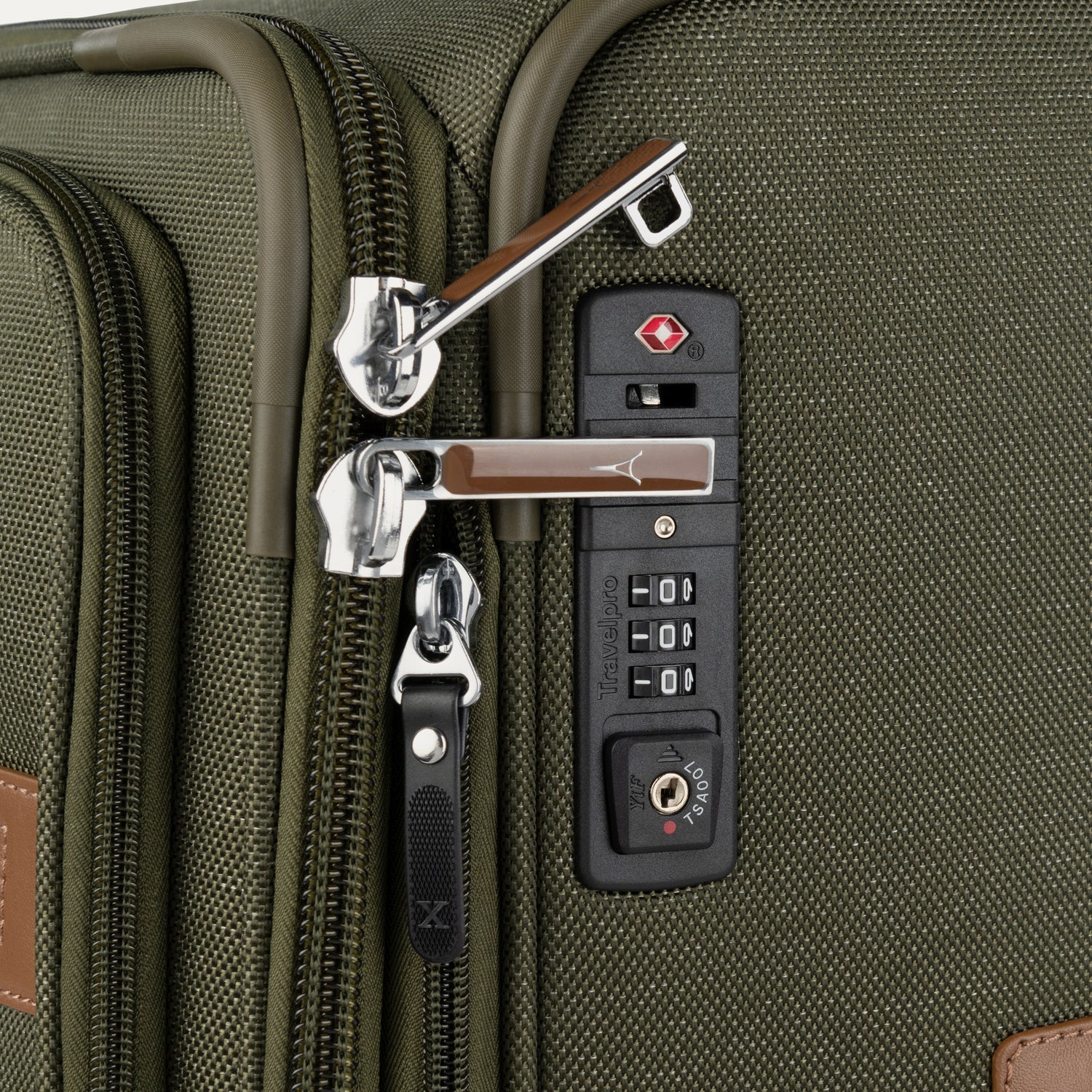 Close-up of a green suitcase with zipper combination lock.
