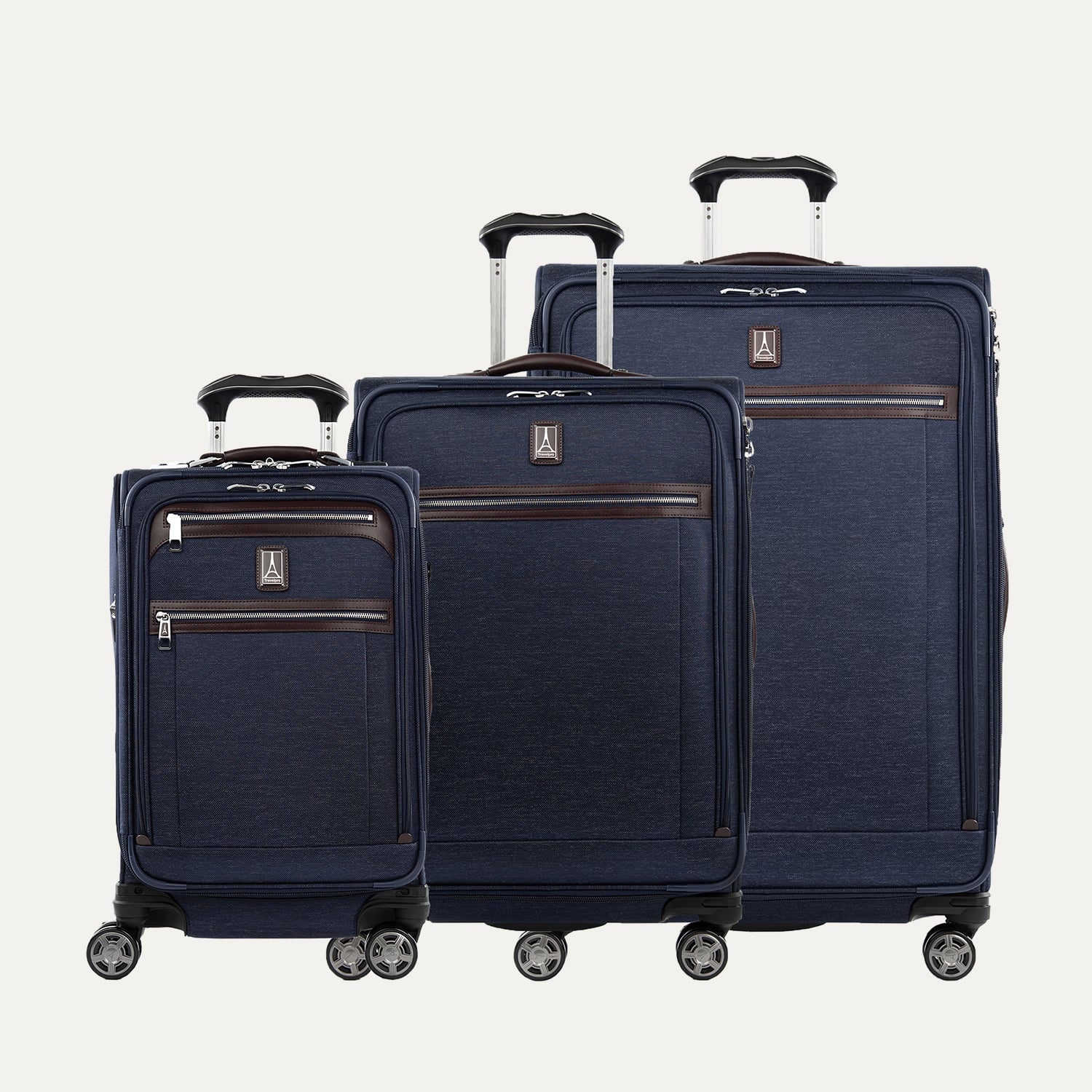 Set of three navy blue suitcases on a white background