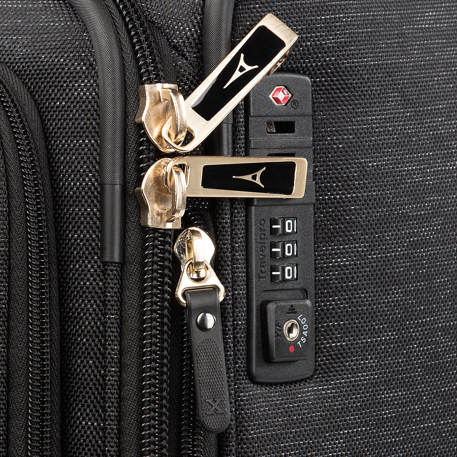 Close-up of a black suitcase with zippers and lock