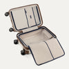 Open suitcase with black wheels on a white background