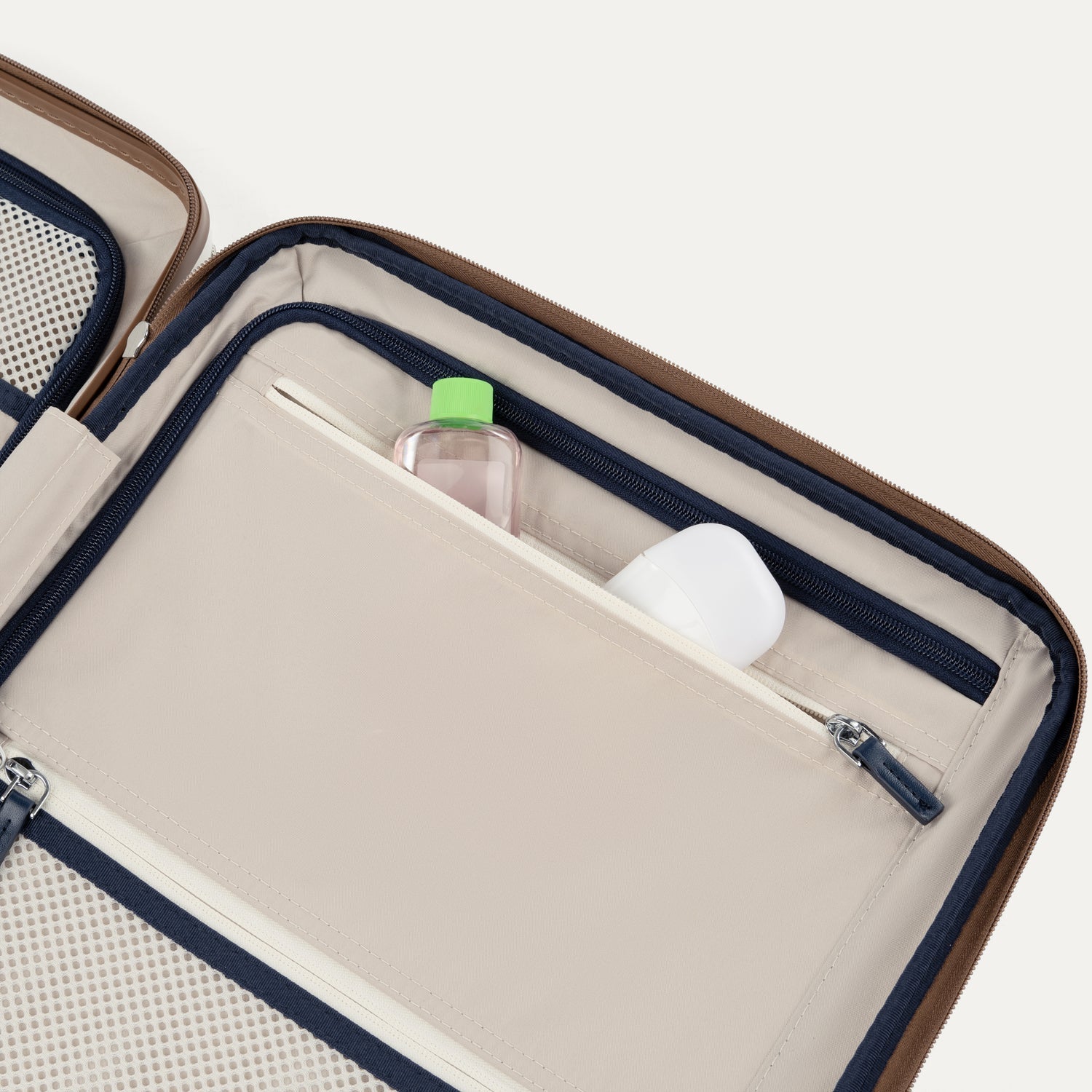 Close-up of a open suitcase interior with toiletries inside.