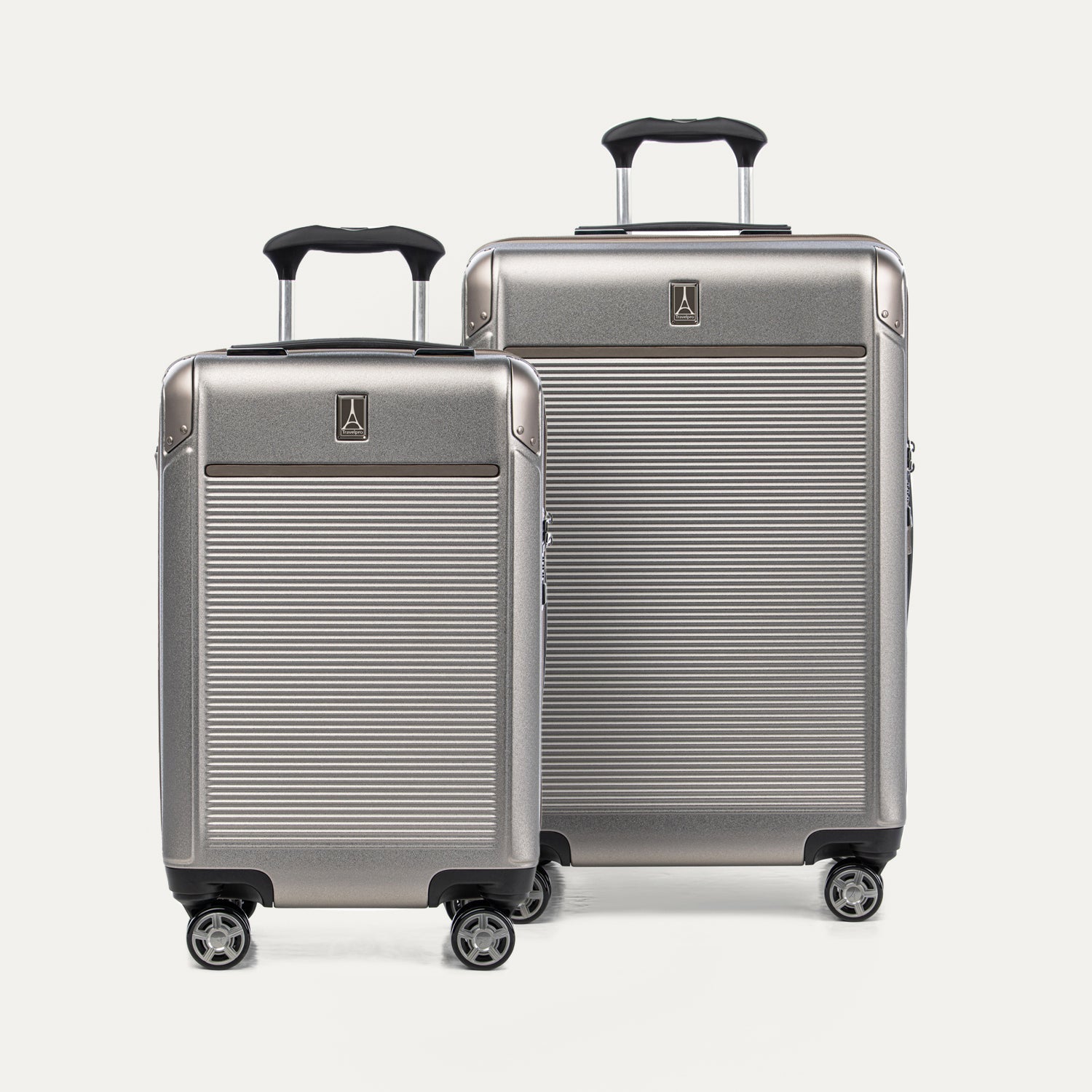 A set of two Platinum Elite hardside spinner suitcases in metallic sand color, including a carry-on and a medium check-in size on a white background.