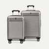 A set of two Platinum Elite hardside spinner suitcases in metallic sand color, including a carry-on and a medium check-in size on a white background.