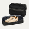 Black weekender with detached shoe compartment on white background 
