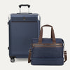 Navy blue suitcase and matching duffel bag with brown straps on a white background
