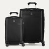 Two black suitcases of different sizes on a white background