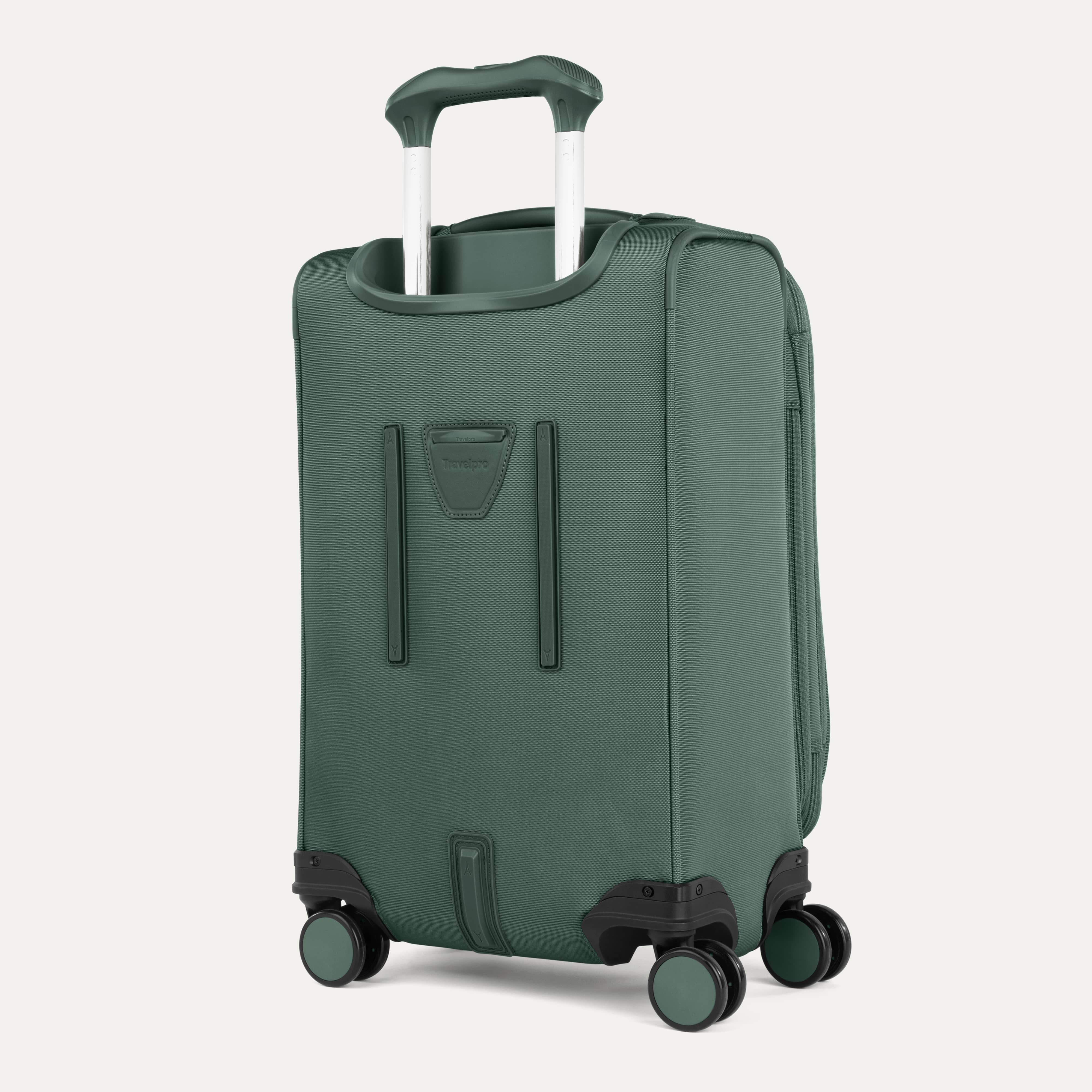 Green suitcase with wheels and handle on a white background