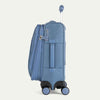 Blue suitcase with black wheels on a white background