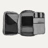Interior view of Travelpross Altitude All-Purpose Laptop Backpack in Jet Black, featuring multiple compartments and zippered mesh pockets.
