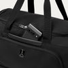 Black weekender with phone in QuickSlip™ pocket, featuring the Travelpross logo