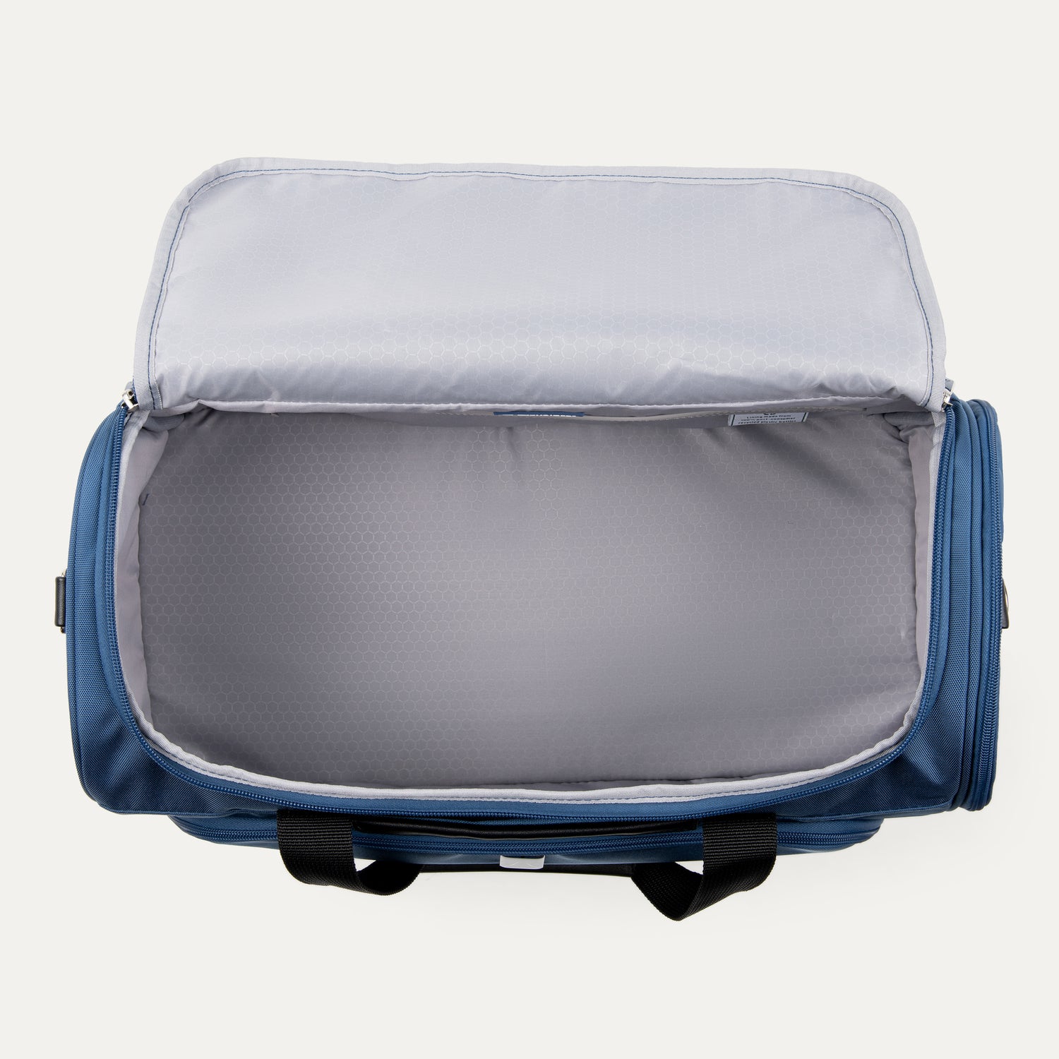 Blue weekender with open lid on a white background