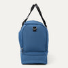Side view of blue weekender with a black strap on a white background