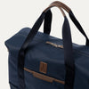 Blue weekender with brown accents on a white background