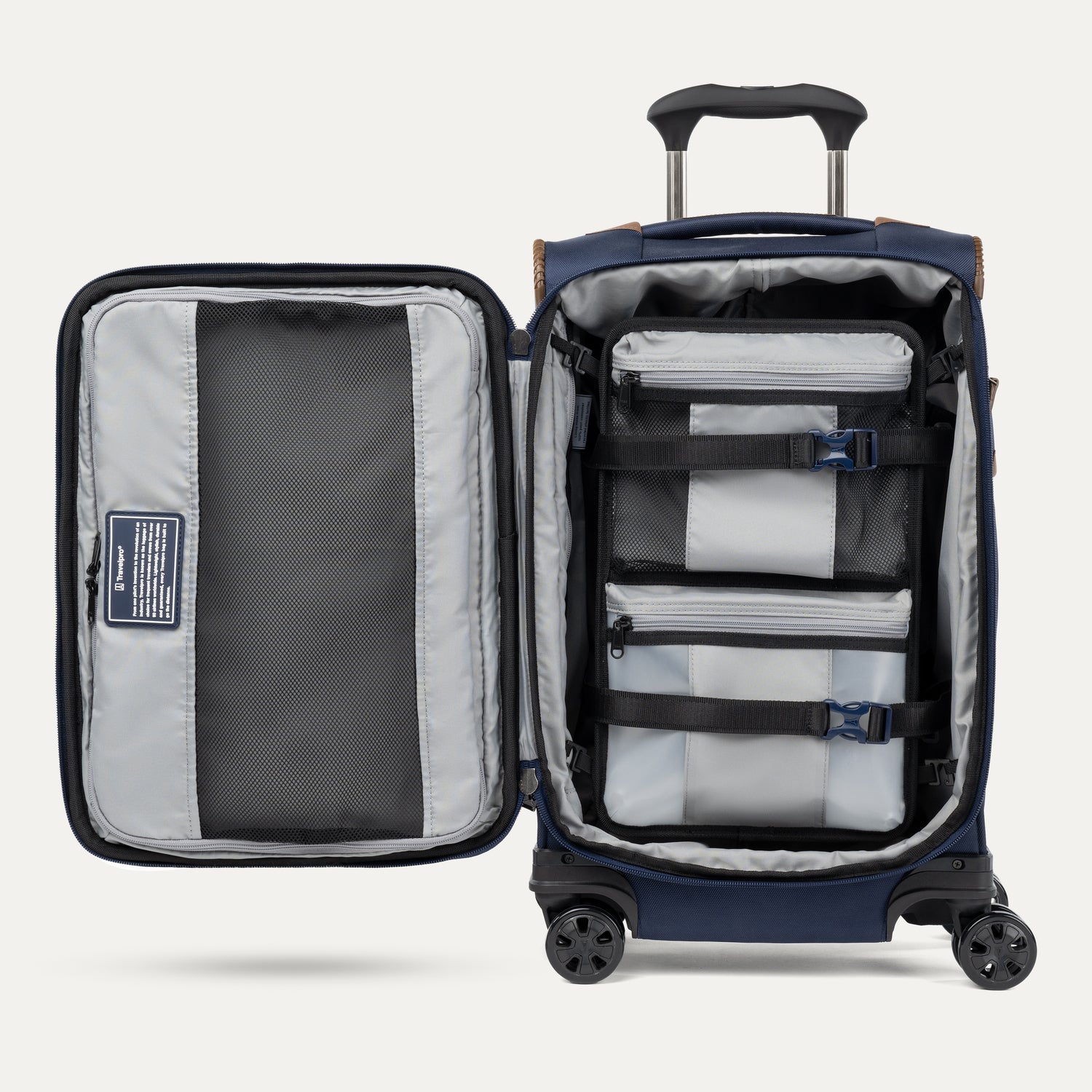 Open navy suitcase with organized contents on a white background