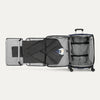 Open suitcase showing suiter with a suit on a white background