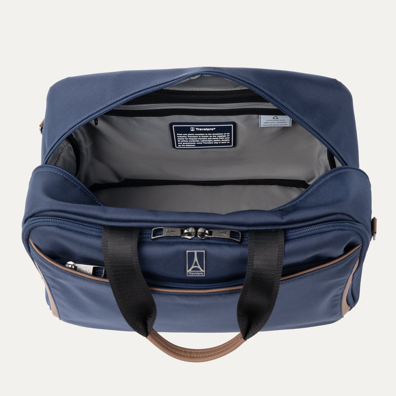 Blue tote bag with open front compartment on a light gray background