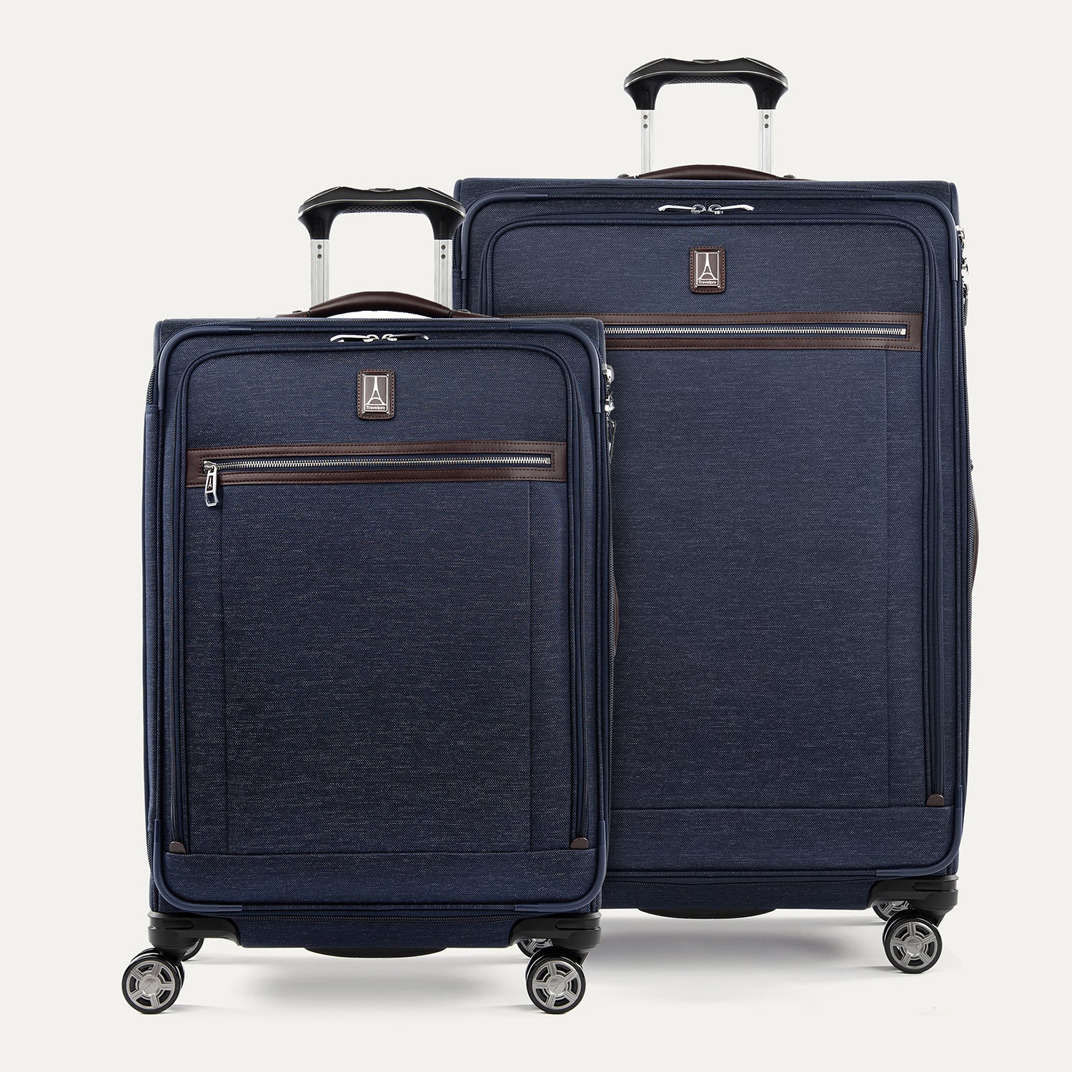 A set of two navy blue suitcases with spinner wheels , a power scope handle and branded with Travelpross logo.