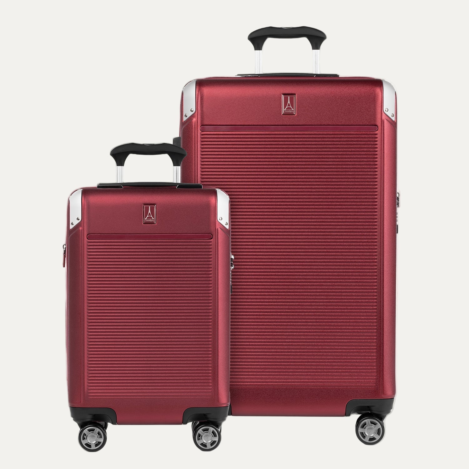 A set of two red hardside spinner suitcases, one carry-on and one check-in size, with the Travelpross logo visible