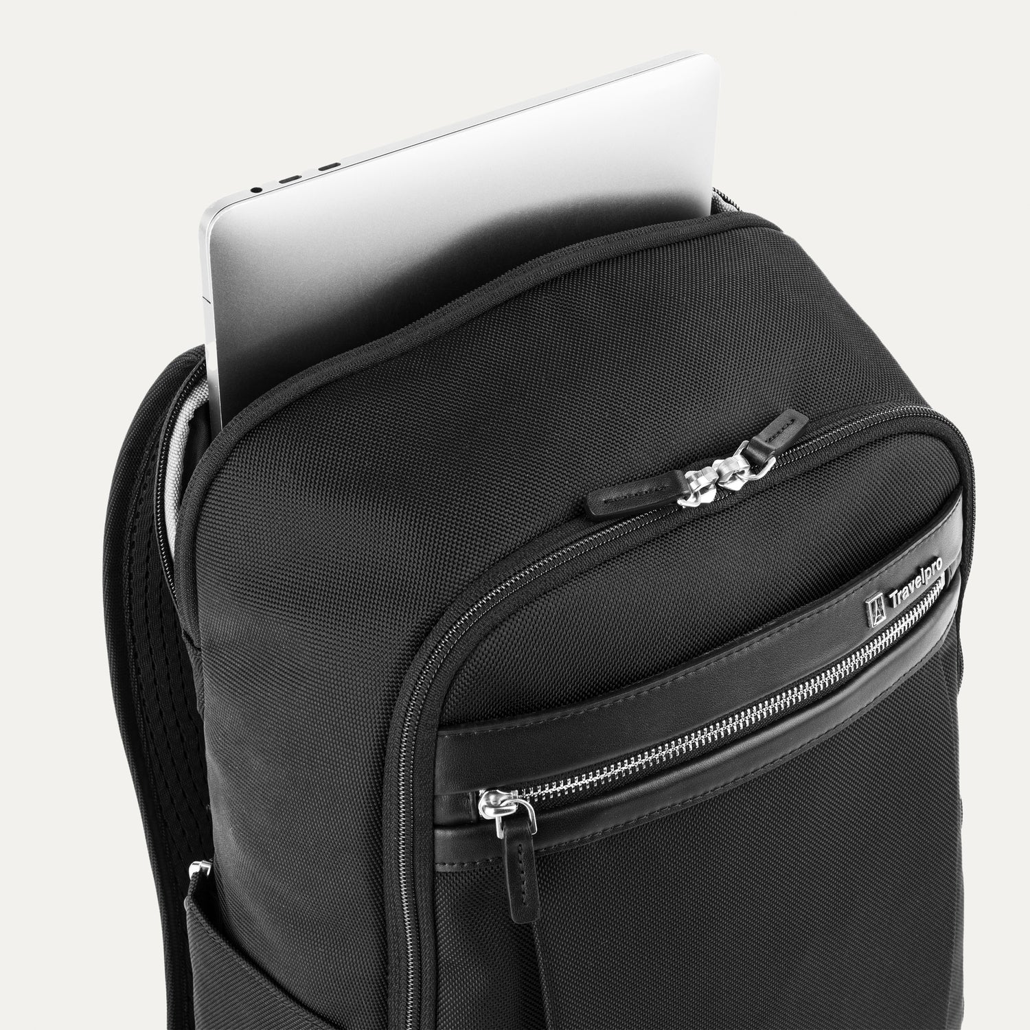 Black backpack with laptop visibly stored in the dedicated sleeve compartment.
