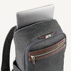 Vintage Gray backpack with laptop visibly stored in the dedicated sleeve compartment.

